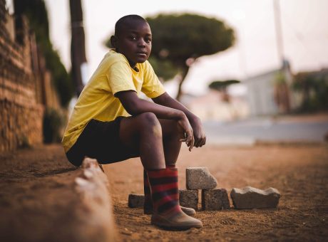 Boy Wearing Yellow Crew-neck Shirt and Black Short